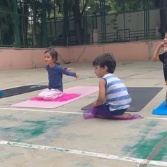 A look at our outdoor program, where we bring "Serious Fun" right to your apartment's doorstep. These images show kids enjoying gymnastics and yoga on mats in both indoor and outdoor community spaces.