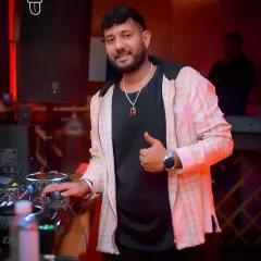 Thumbs up from the DJ booth. A simple gesture to show I'm locked in and ready to make the night memorable.