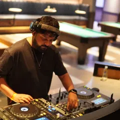 Mixing tracks in the elegant lounge at DLF Camellias. This venue has a great vibe, perfect for blending different genres like R&B, hip-hop, and house music.