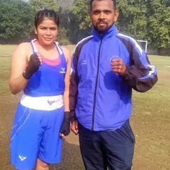 I stand with one of our champions, Simran Maurya, after her gold medal win at the 2024 Delhi Olympic Games. We train both male and female boxers to compete and win at the highest levels.