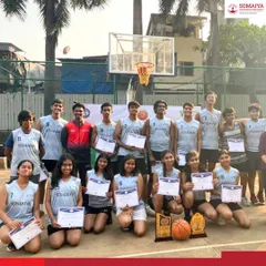 Both the boys' championship team and the girls' runner-up team from K. J. Somaiya Polytechnic pose together with their basketball trophies.