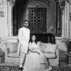 A timeless black and white portrait of a newly engaged couple, posing with regal elegance at a heritage palace in Patiala.