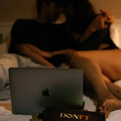 Setting a scene for a cozy night in. The product is placed naturally within a relatable lifestyle setting, suggesting it's the perfect companion for a movie night.