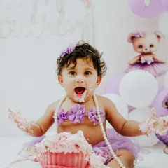 She came, she saw, she smashed. This little fairy had the best time at her purple-themed cake smash, complete with a giant cupcake just for her.