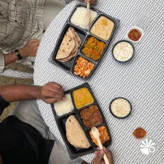 This is my favorite sight: friends and family enjoying a wholesome meal together, even on a busy day. My packed thalis bring that comfort right to your table, complete with dal, sabzi, roti, rice, and even a little something sweet.