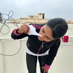 This student is performing the Jala Neti kriya, a saline nasal wash. This practice is excellent for clearing allergens and pollutants from the nasal passages, helping to ease breathing.