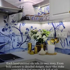 A kitchen can be a canvas for artistry. These hand-painted tiles tell a story, bringing a layer of personality and life that transforms a simple wall into a unique focal point. It is in these quiet, crafted details that a house truly becomes a home.