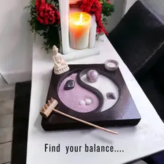 Find your balance with this desktop Zen garden. The Yin Yang design represents harmony, and raking the dual-colored sand around the amethyst crystal is a simple, meditative practice to center your thoughts.