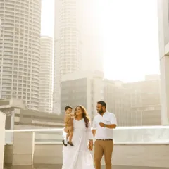 A family walk against the Mumbai skyline. An urban outdoor shoot can be just as beautiful, capturing your family in the city you call home.