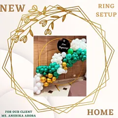 A simple and elegant balloon ring setup for a new home celebration. This decor features a combination of green, white, and gold balloons on a golden ring, perfect for housewarming parties.