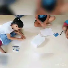 Deep in concentration during a drawing session. We provide all the necessary materials and guidance, allowing children the freedom to express their imagination on paper and develop their artistic skills.