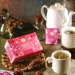 A product shot of Mittal Teas' Jasmine Ginger tea, styled with a clean, bright aesthetic. The action of pouring water into the cup adds a dynamic element while keeping the focus firmly on the product.