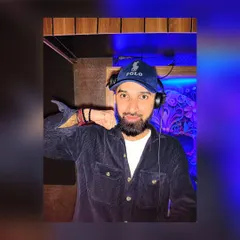 A fun, energetic pose from the DJ booth. I bring my full personality to every performance.