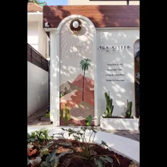 A view of the mural from the garden, showing how it creates a cheerful and picturesque spot for customers.