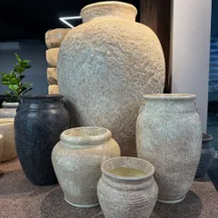 A collection of our rustic, stone-finish planters. These are great for adding an earthy, natural feel to your space.