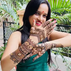 A happy client is the best reward for my work. Here she is, glowing with joy and showing off her intricate engagement mehndi, filled with traditional motifs and personalized details.