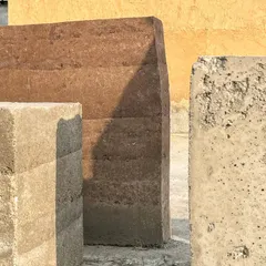 I am fascinated by the "colours of earth." This image shows experiments with rammed earth, exploring its textures and tones. Using local, natural materials is fundamental to creating buildings that feel authentic and sustainable.