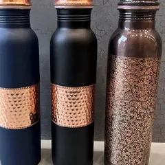 I offer a range of copper-accented bottles perfect for festive or wellness-themed gifting. This image shows three different designs: hammered copper, plain copper band, and an engraved paisley pattern.