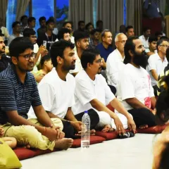 Participants listen intently during a session. We offer many volunteering opportunities at our International Center, providing a path for total transformation through Sadhana, Seva, and Satsang.