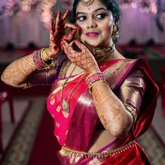 A playful and candid portrait of the bride. Her dance-like pose and happy expression show her personality and the joy of the wedding day.