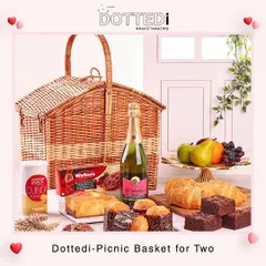 Another view of the popular "Picnic Basket for Two," showcasing the delicious assortment of croissants, muffins, brownies, and other treats ready for a romantic escape.
