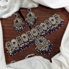 This Victorian choker set in a deep sapphire blue is perfect for evening events. The combination of dark blue stones and sparkling white accents creates a look of sophisticated elegance.