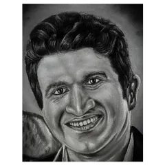A close-up of my charcoal and white stone powder portrait of Puneeth Rajkumar. This view highlights the detailed shading and line work used to capture his likeness and gentle expression.