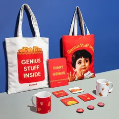 A group shot of the Parle-G merchandise, including tote bags, mugs, and coasters. The clean, color-blocked background aligns with the brand's iconic packaging and creates a strong, cohesive look.