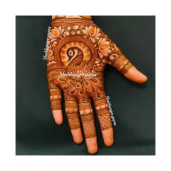 A heavy and intricate peacock design covering the entire palm. The detailed feather work and surrounding floral patterns make this a true statement piece.