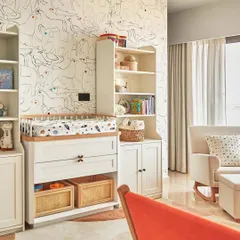 For a child's nursery, I created this playful and imaginative wall doodle. A continuous line drawing of animals and birds fills the wall, with colorful polka-dot eyes adding a touch of whimsy and fun to the space.