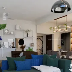 A vibrant and spacious living room designed for family life. The open layout connects different seating areas, while the custom shelving wall provides a personal touch, displaying art and family heirlooms.