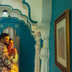 An intimate embrace within a beautifully designed alcove. Even in a grand palace, I look for these small, colorful corners to capture quiet, romantic moments that feel personal and secluded.