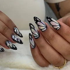 Another perspective on the iridescent butterfly nails. Learning to create this chrome and black line work effect is part of my advanced art classes.