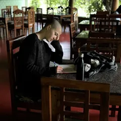 Journaling and self-reflection are integral parts of the training. Here, a student finds a quiet moment in our dining hall to process the day's lessons, a practice we encourage to deepen personal understanding and growth.