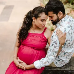A tender moment between an expecting couple during an outdoor shoot. The way they connect, forehead to forehead, tells a story of partnership and shared excitement for their journey into parenthood.