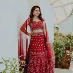 This bride-to-be was all smiles in her vibrant red lehenga for her engagement. I gave her a classic glam look with defined eyes, radiant skin, and open-styled hair with soft waves.