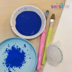 The simple materials for our hydrangea art project: paint, brushes, and bubble wrap. We believe creativity can be sparked with everyday items.