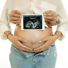 The first picture of your baby. This classic shot features the sonogram held over the baby bump, a simple and powerful way to announce and celebrate the new life on the way.