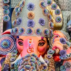 A close-up view of the Lord Ganesha idol, where the mukut (crown) and garlands are intricately crafted from folded currency notes. This highlights the detailed artistry and devotion I bring to every aspect of my decoration work.