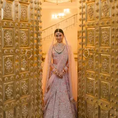 A bride's grand entrance is a moment of pure magic. I worked with Vibha to style her Anamika Khanna lehenga and the decor, ensuring her reveal through these magnificent golden doors at Mementos by ITC Hotels felt nothing short of royal.