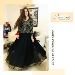 A client's joy is everything. This beautiful black lehenga, with its shimmering gold border, was made from an old saree. The twirl-worthy skirt and patterned top came together to create an outfit she absolutely loved.