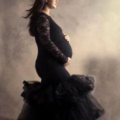 In the quiet of my studio, we can create powerful, fine-art portraits like this. The focus is entirely on you, your strength, and the beautiful shape of motherhood, captured in a classic, elegant style.
