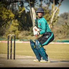 A batsman, focused and ready at the crease during a competitive match. Our training camps emphasize real match preparation, ensuring every player develops the technique and temperament to face any bowler with confidence. This is where practice meets performance.