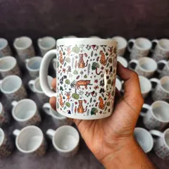 Your mug can be a canvas for any design. This one features a full-wrap jungle animal pattern, showing the versatility of my custom printing services for bulk or single orders.