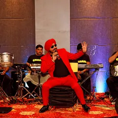 We also cover event performances. Here's a shot of a singer entertaining guests at a wedding sangeet.