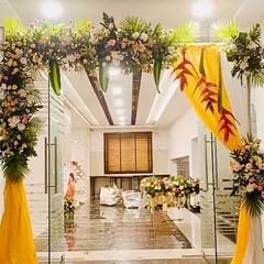An elegant floral archway at the entrance to the 'Board Room' where the half saree ceremony is being held.