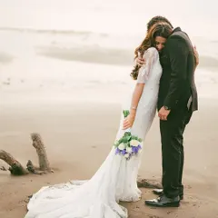 An intimate embrace on the shore, where the world fades away leaving just two people. This is the essence of our fine art style, capturing the quiet, powerful connection between a couple in a timeless, cinematic frame.