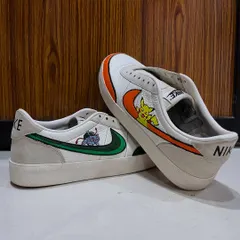 Another perspective of the finished Pokémon sneakers, showing how the art wraps around the shoe. This custom shoe painting project is a great example of how to personalize your favorite footwear.