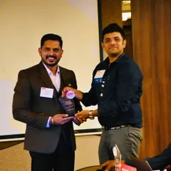 It's an honor to be recognized for our work and our contribution to the business community. Here I am receiving an award at a BNI (Business Network International) event.