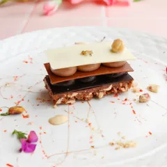 We deconstruct classic pastries to create new experiences. This Chocolate Mille-feuille features crisp layers of chocolate and pastry interspersed with creamy fillings, offering a symphony of textures in every bite.